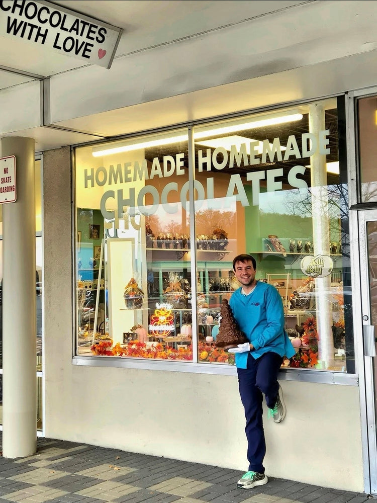 Smiling in front of the Chocolates With Love shop window